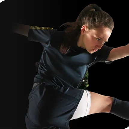 Young athlete in action wearing a dark sports uniform